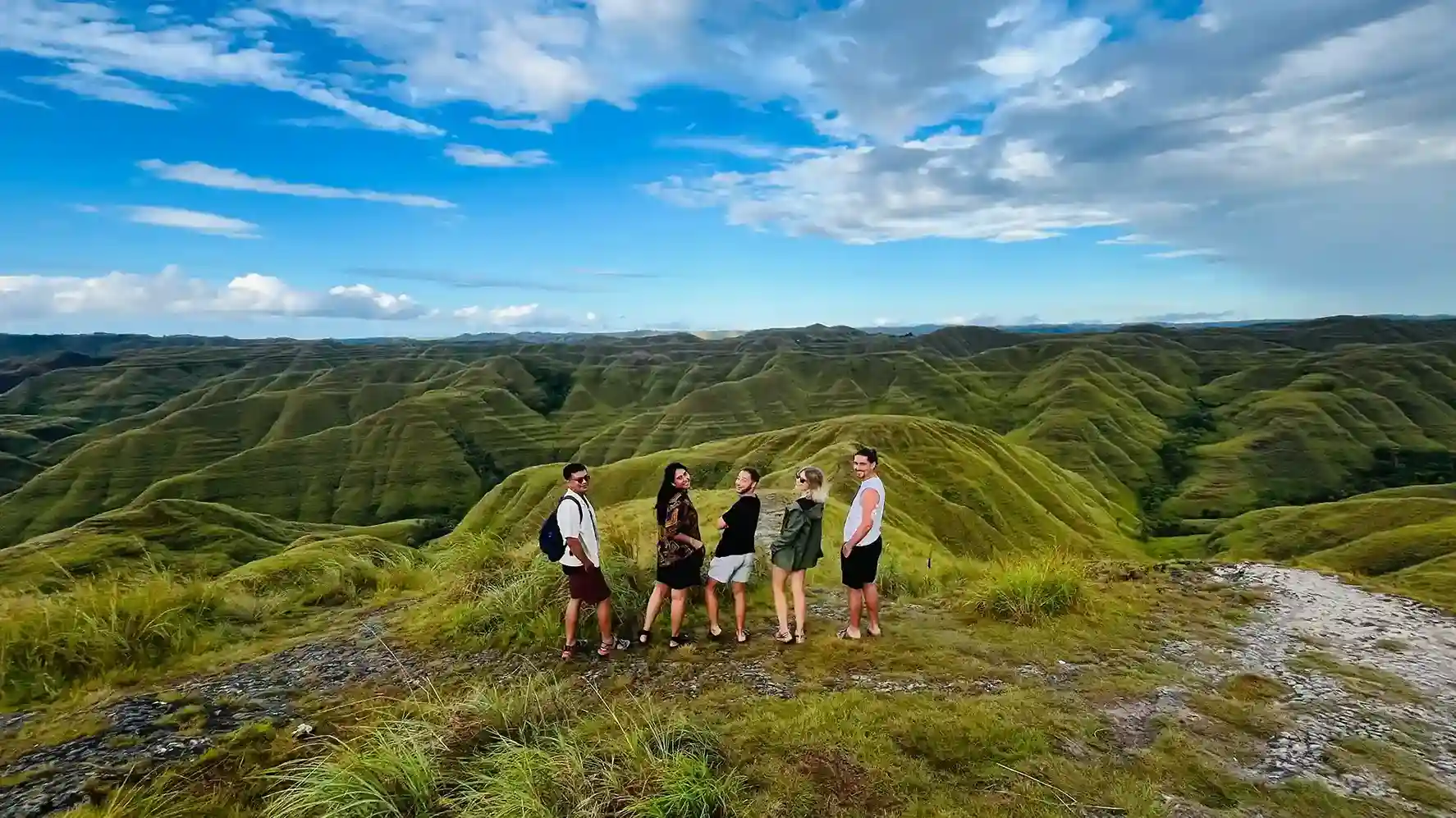 The team and guests on a savanna hilltop in Sumba